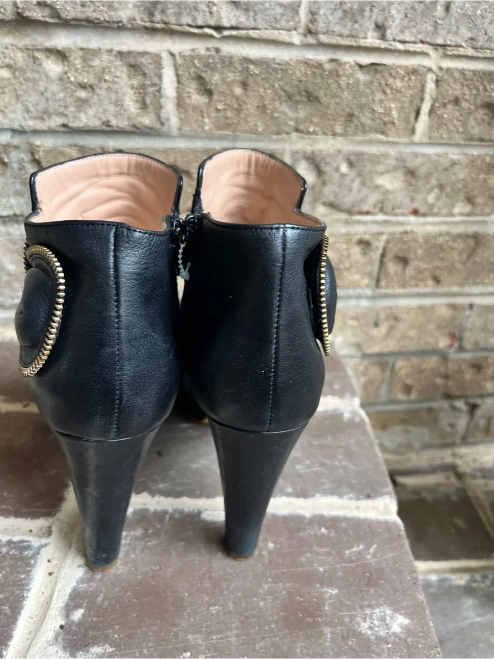 See By Chloe Black Leather Ankle Booties with Gold Zipper Bow Accent